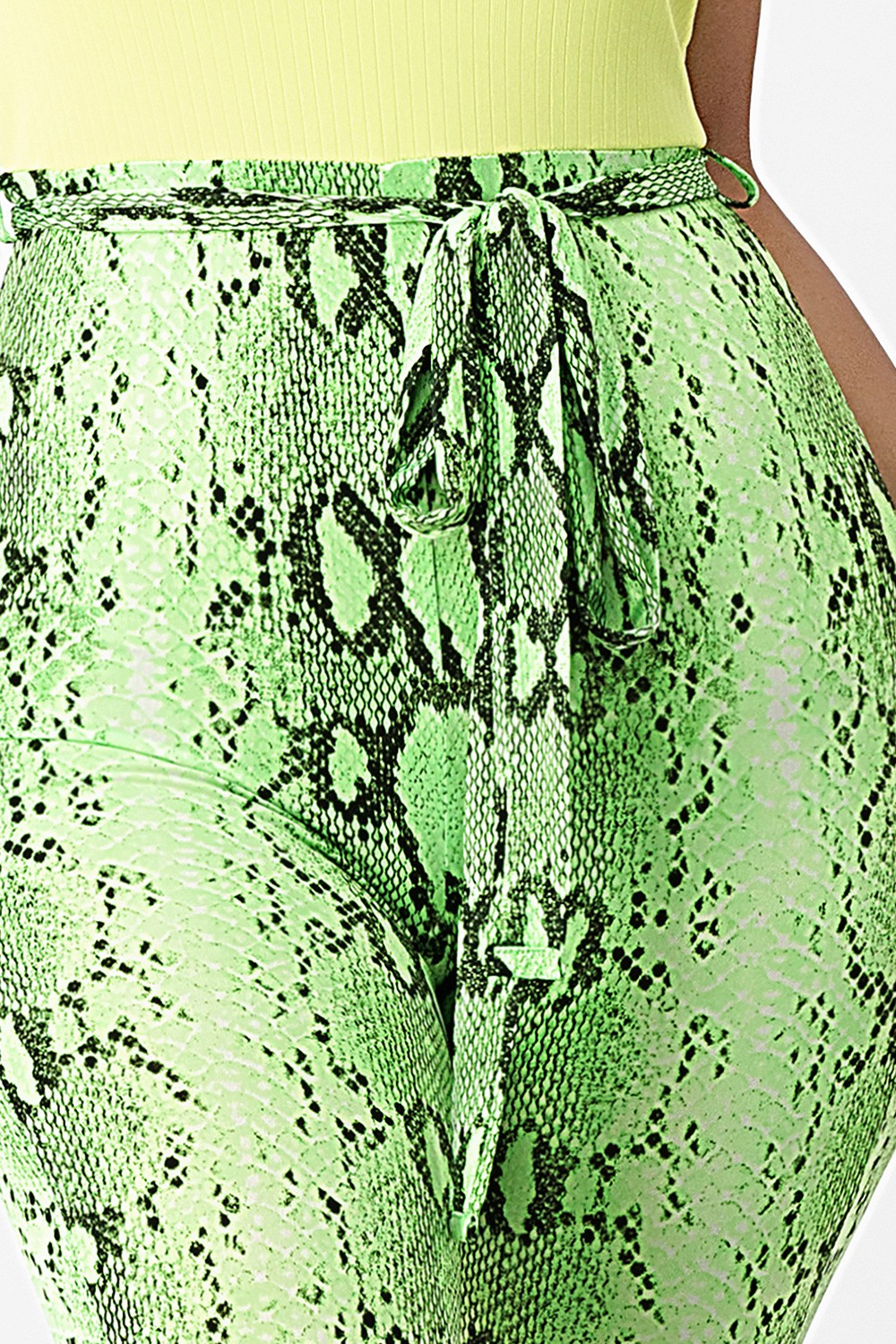 Green snake print skirt with a close-up view