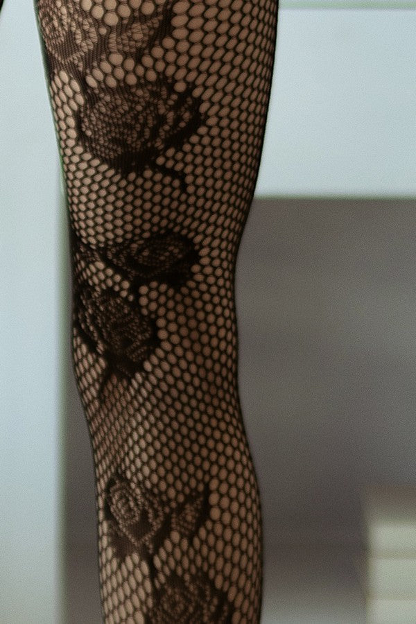 Black lace fishnet stockings on a white background