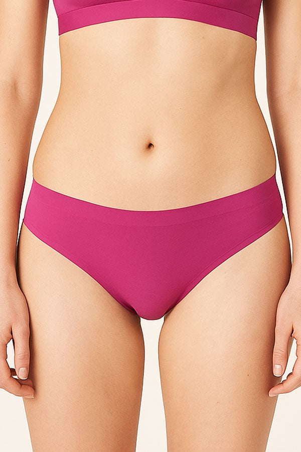 Person wearing a fuchsia bikini set on a plain background