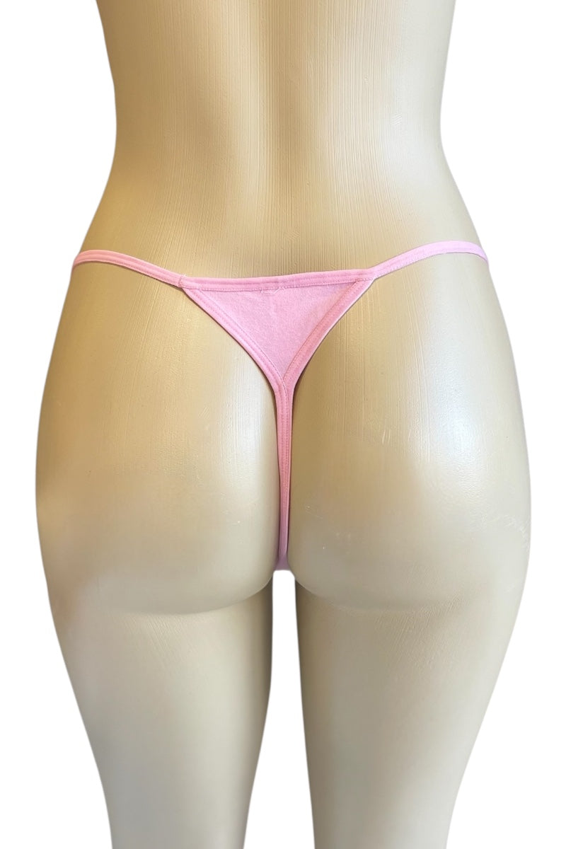 Pink thong on a mannequin against a white background