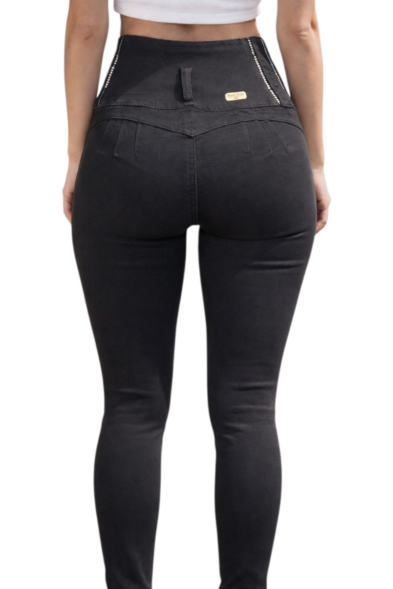 Black pants worn by a person on a white background