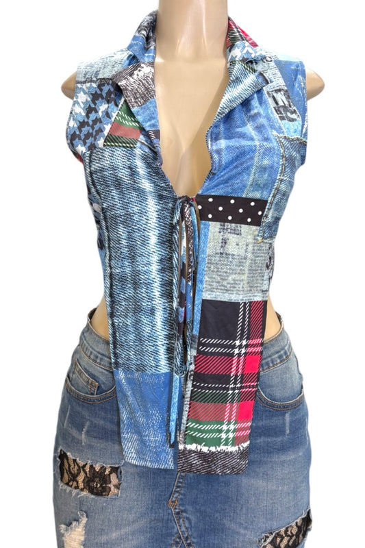 Mannequin wearing a patchwork denim crop top with colorful accents on a white background