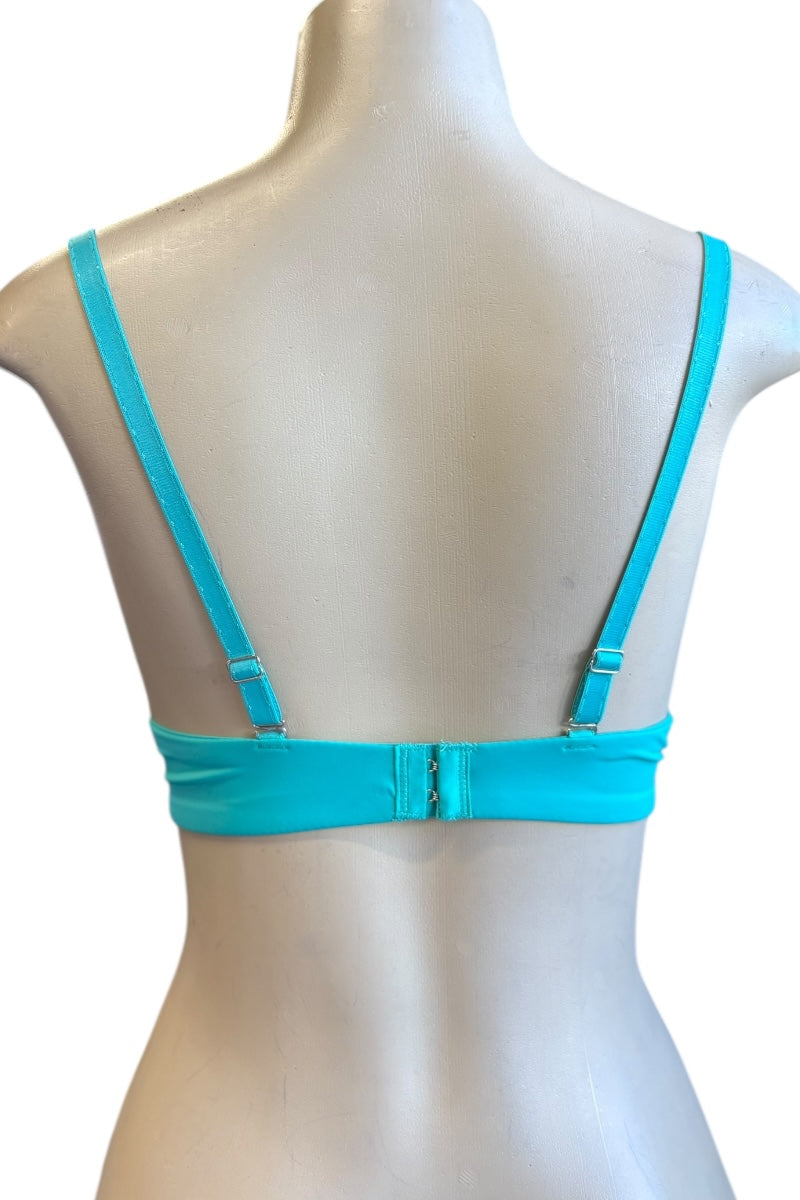 blue bra on a mannequin with a white background