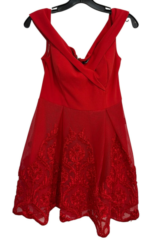 Red dress with lace details on a white background