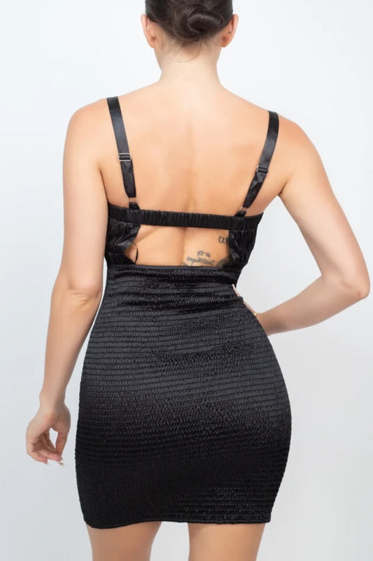 Black dress with open back on a white background