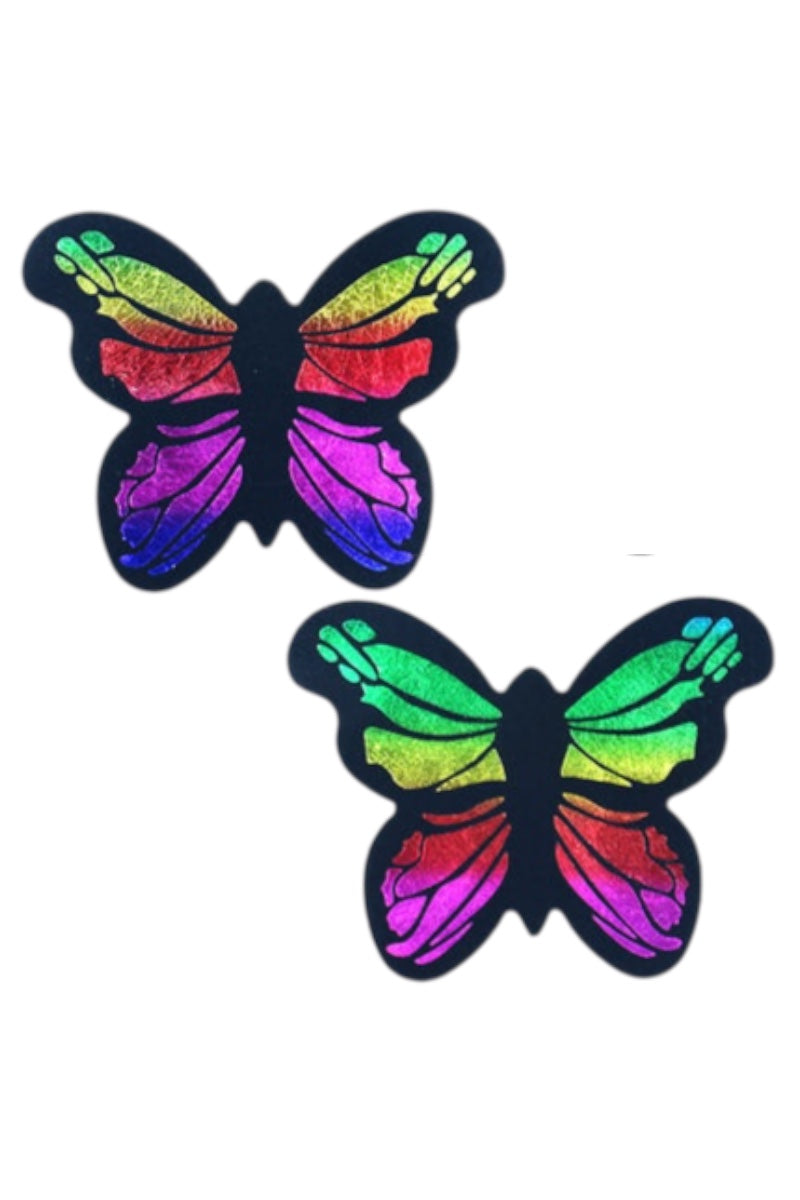 Two colorful butterfly-shaped pasties on a white background