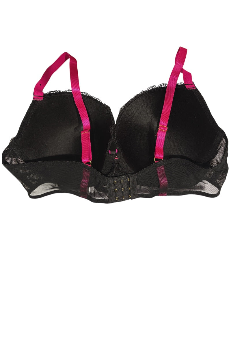 Black bra with pink straps on a white background