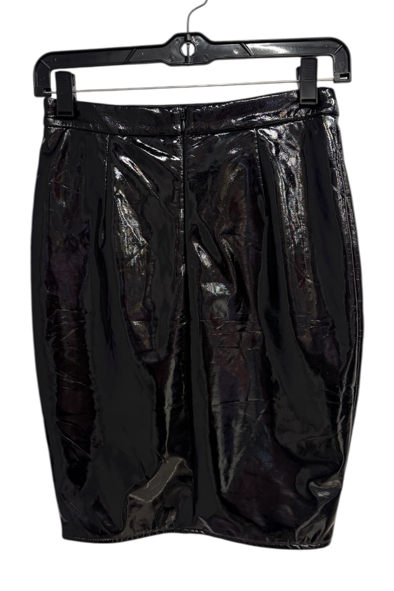 Black glossy skirt on a hanger against a white background