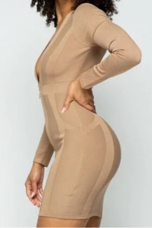 Beige bodycon dress worn by a person on a white background