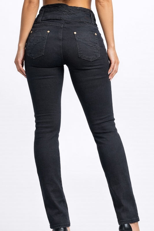 Black jeans worn by a person on a white background