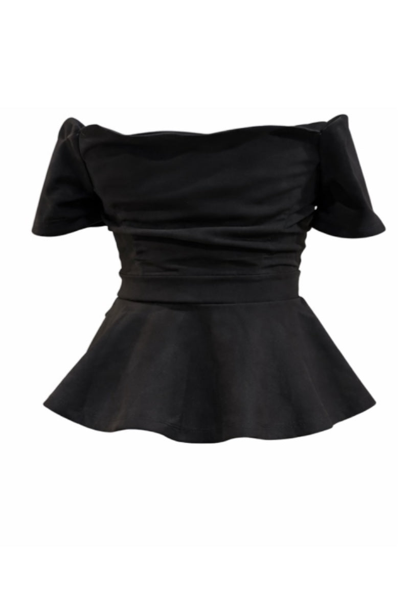 Black peplum top on a white background