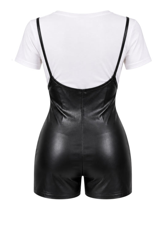 Black faux leather romper with thin shoulder straps and a white short-sleeve bodysuit layered underneath, shown from the back on a white background.