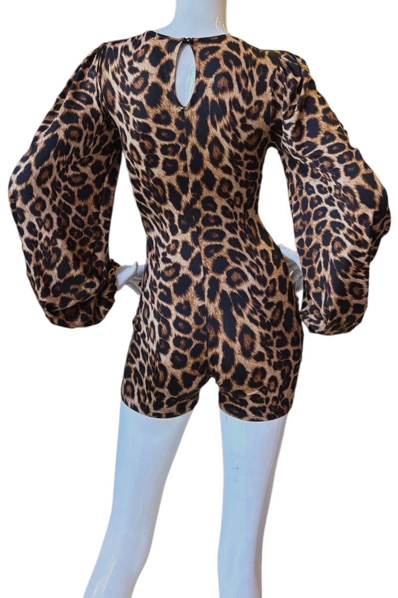 A leopard print romper displayed on a white mannequin, showing the back view with dramatic balloon sleeves and a keyhole cutout at the neckline.