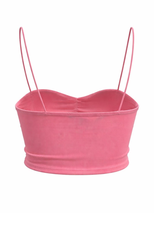 Pink crop top with thin straps on a white background