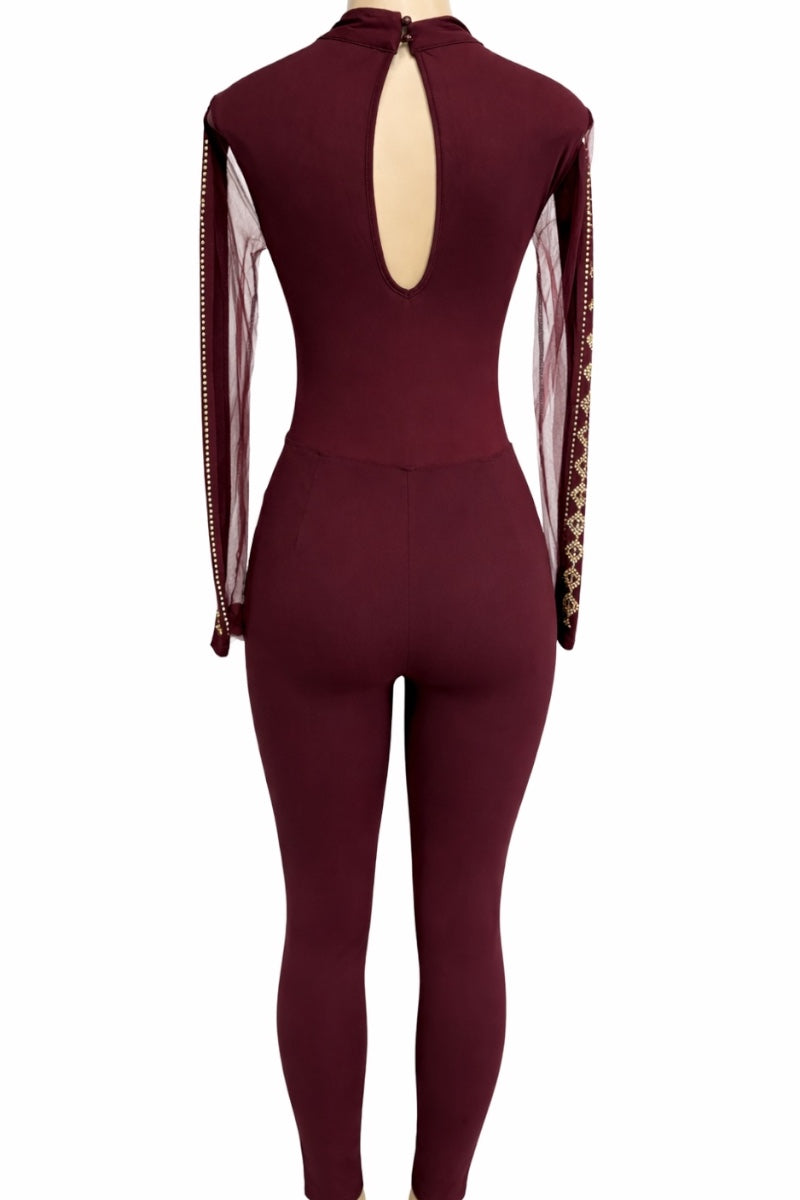 wine jumpsuit with sheer sleeves on a white background