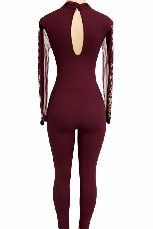 wine jumpsuit with sheer sleeves on a white background