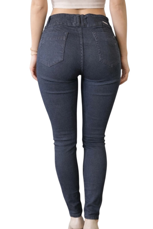 Black jeans worn by a person on a white background
