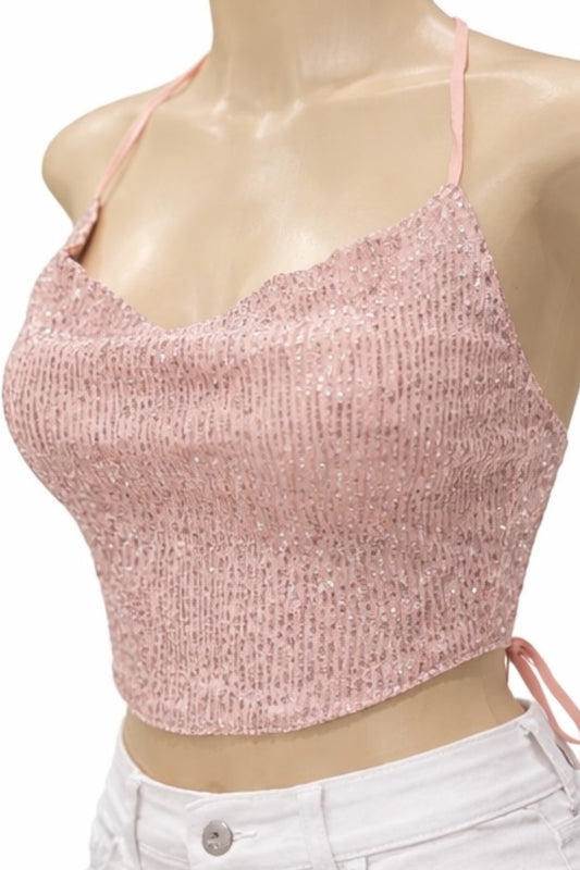 Pink sparkly crop top on a mannequin with a white background
