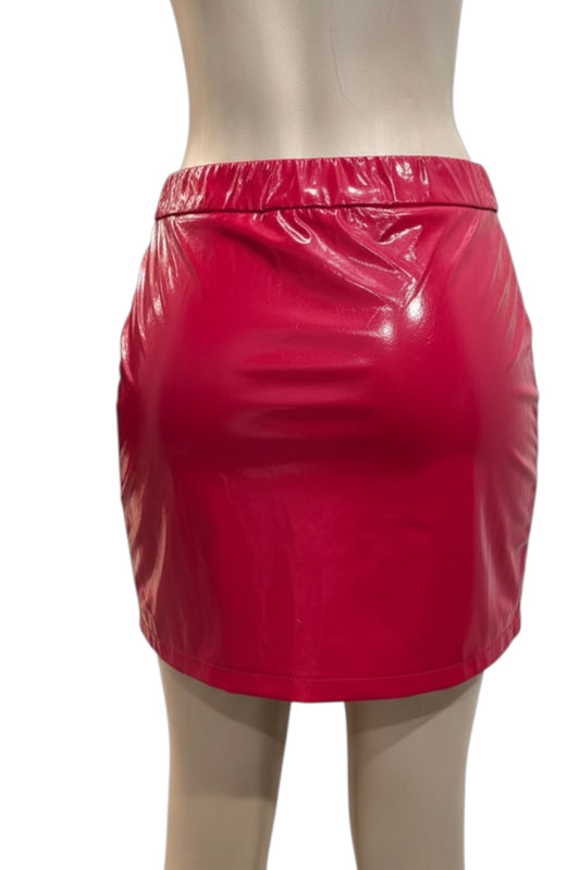 Red vinyl skirt on a mannequin against a white background