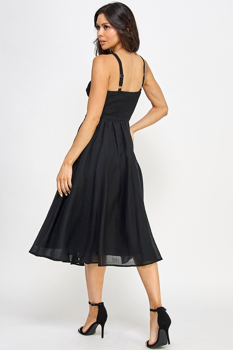 Woman wearing a black dress on a white background