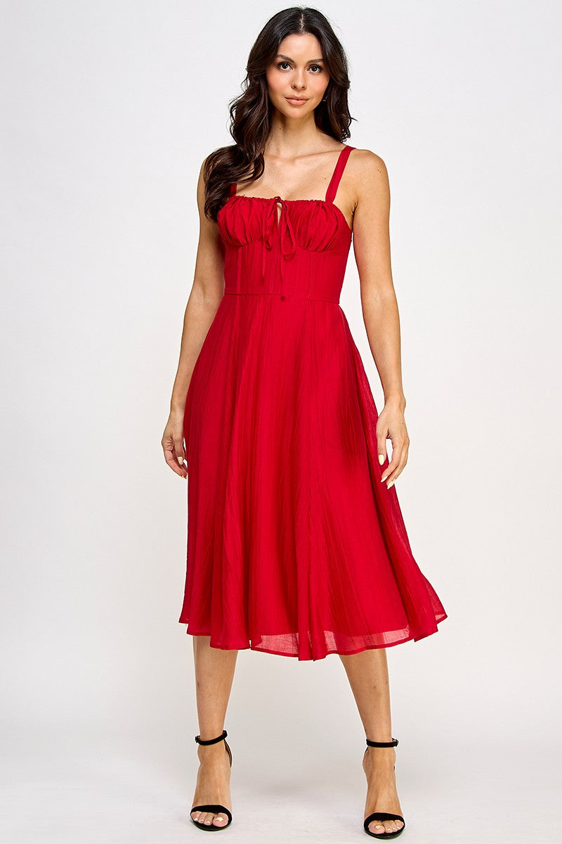 Woman wearing a red dress on a white background