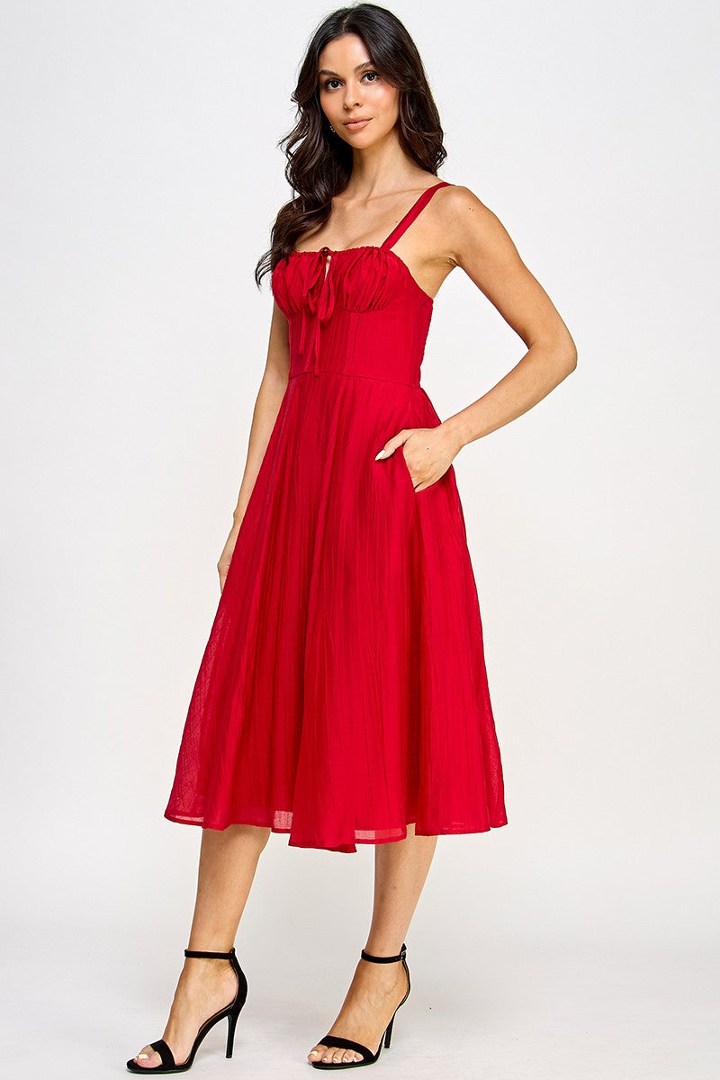 Woman wearing a red dress on a white background