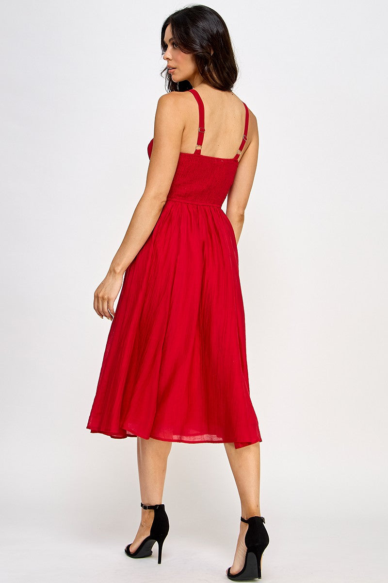 Woman wearing a red dress on a white background