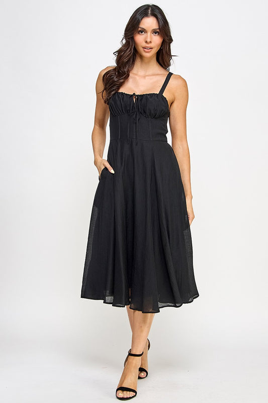 Woman wearing a black dress on a white background