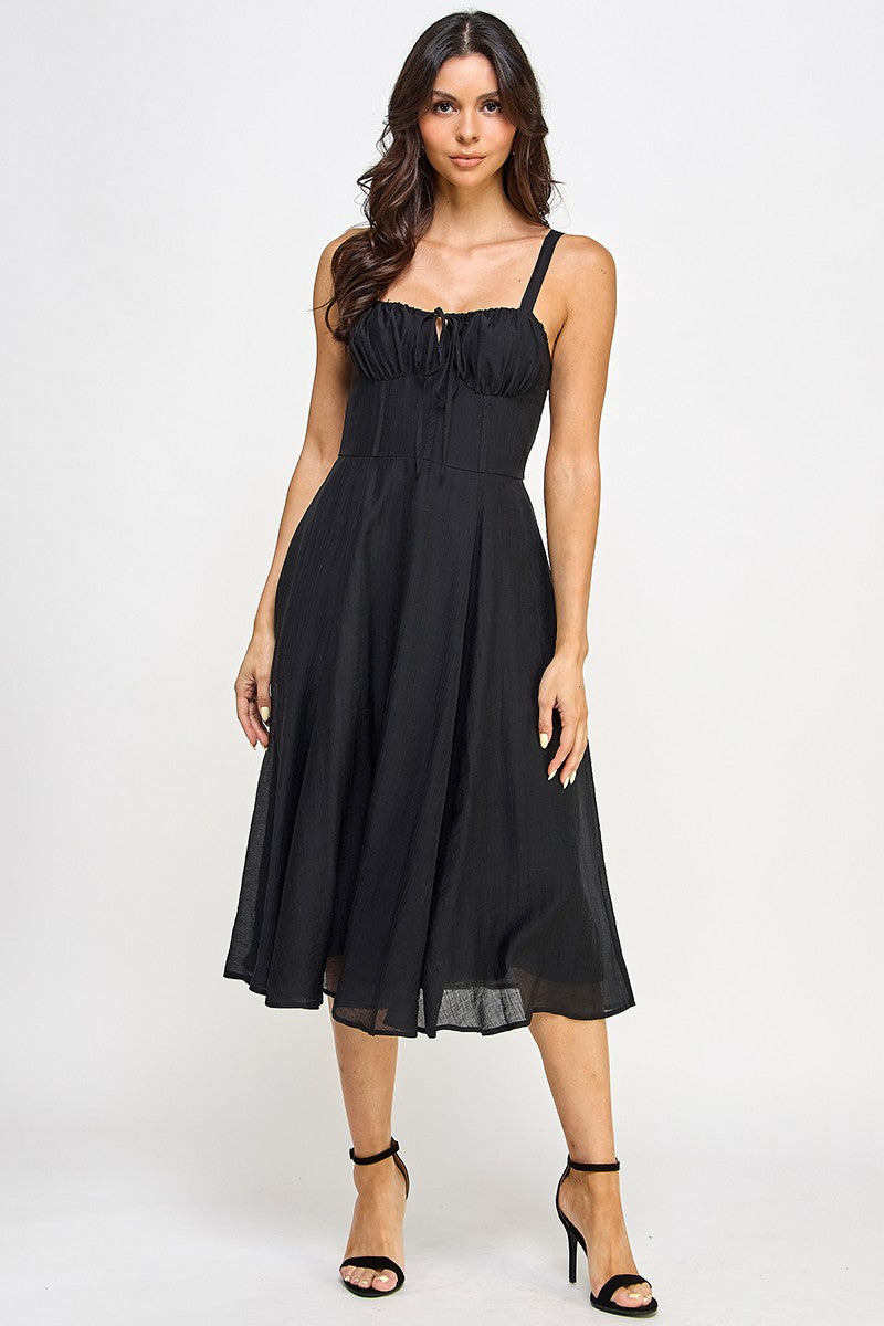 Woman wearing a black dress on a white background