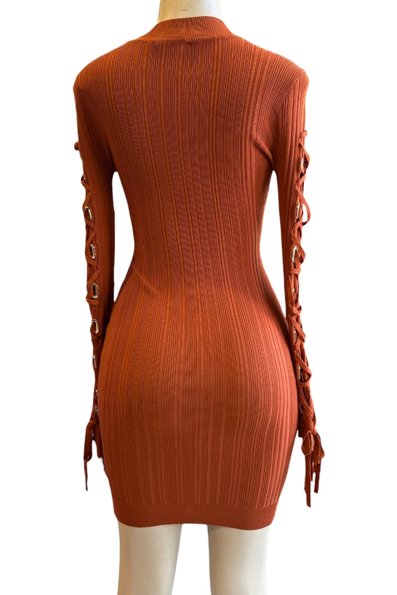 rust ribbed sweater dress with lace-up sleeves on a mannequin against a white background