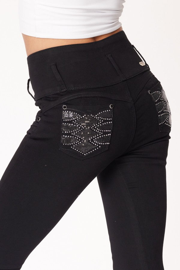 Black pants with embellished pocket on a white background
