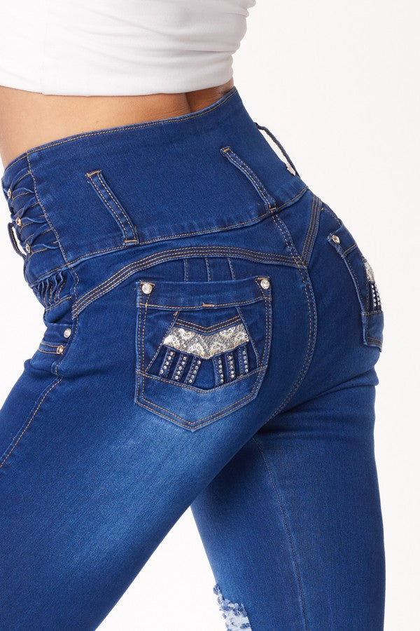 Blue jeans with decorative pocket on a white background
