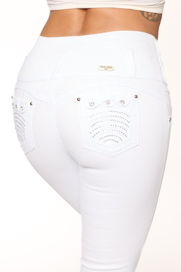 White high-waisted pants with decorative elements on a white background