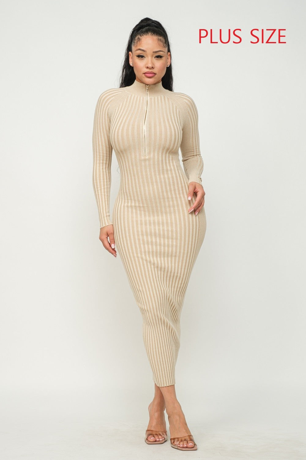 Woman wearing a cream ribbed dress with 'Plus Size' text on a white background