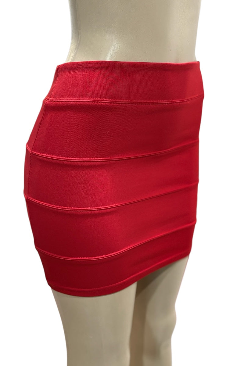 Red bandage skirt on a mannequin against a white background