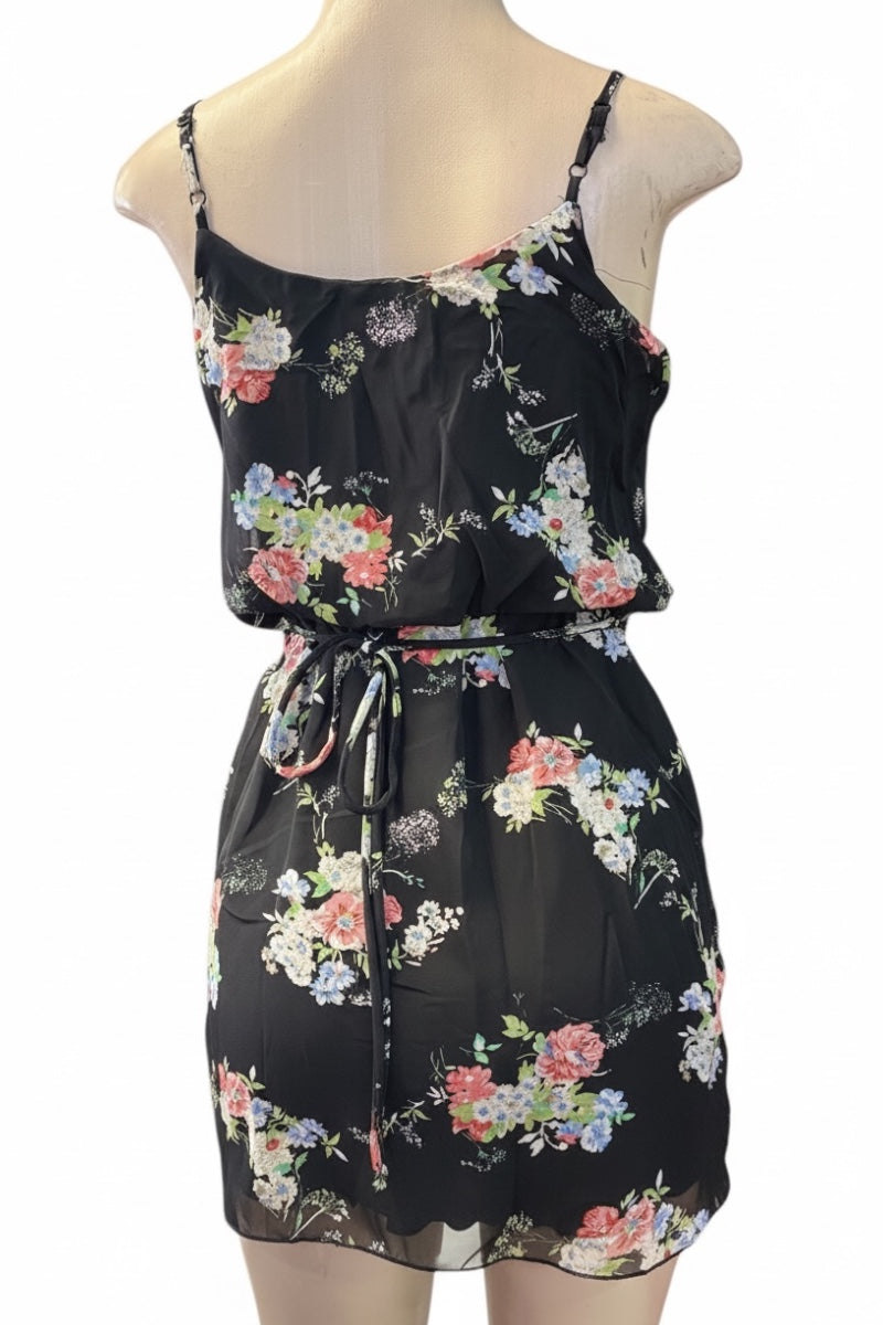 Black floral dress on a mannequin against a white background