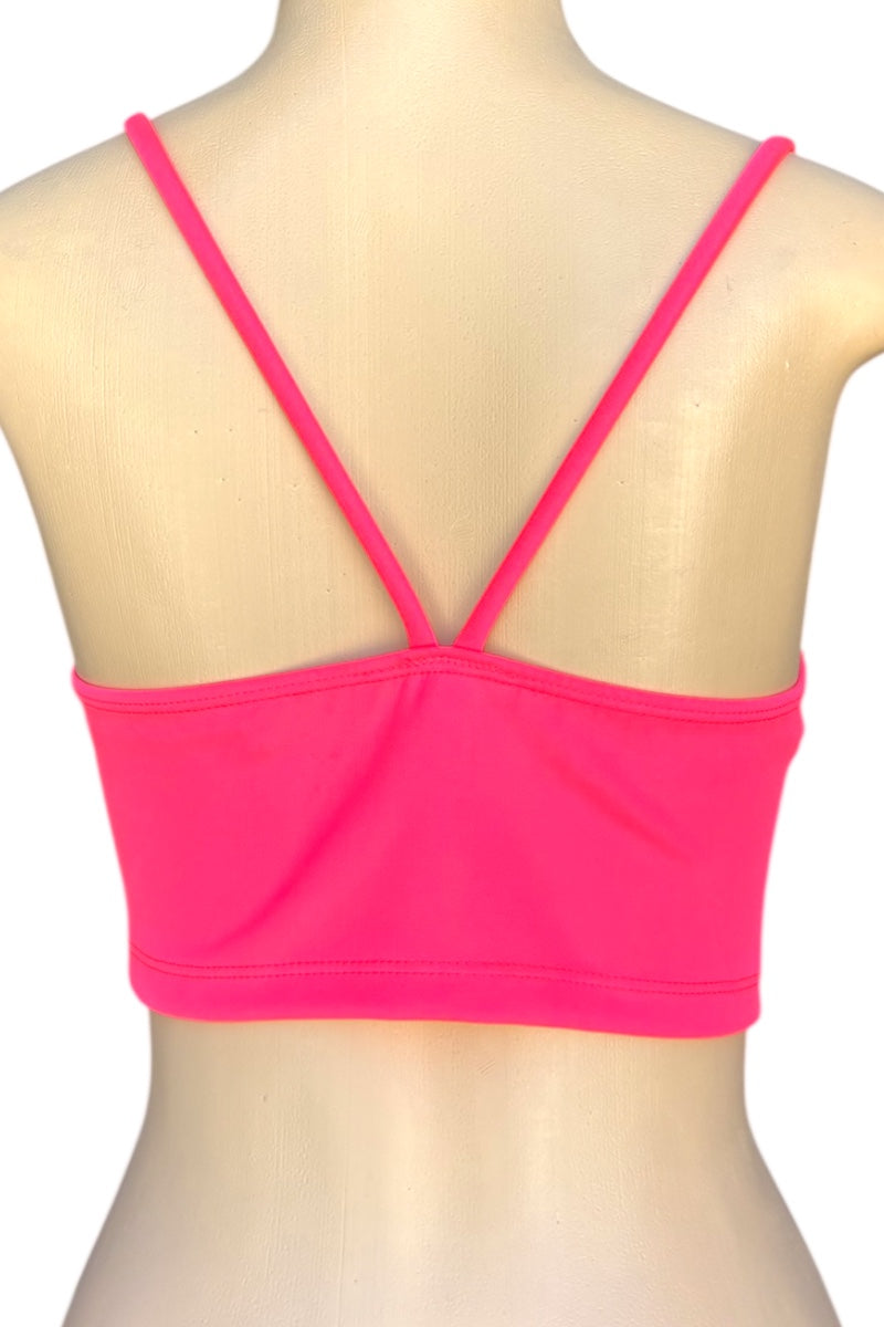 Pink crop top on a mannequin with a white background