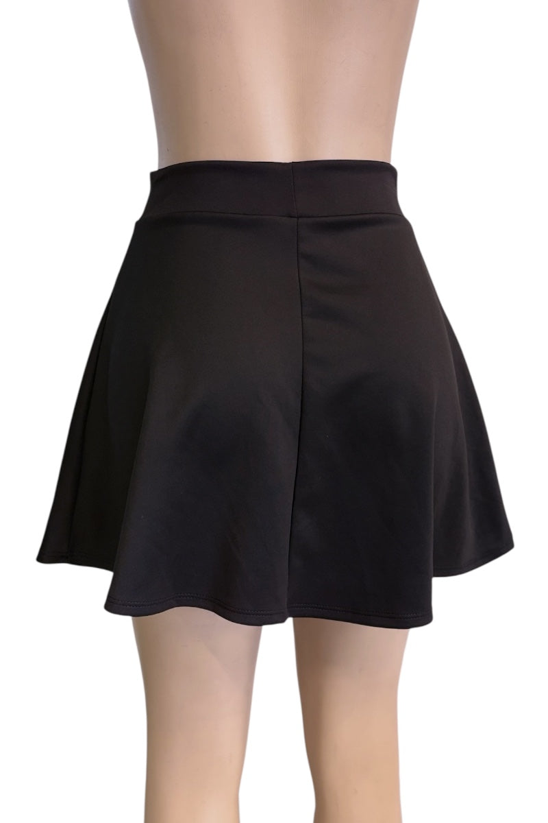 A black flared mini skirt shown from the back on a mannequin torso and legs against a plain white background.