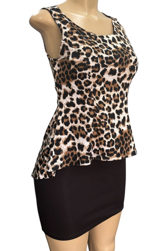 Leopard print top and black dress on a mannequin against a white background