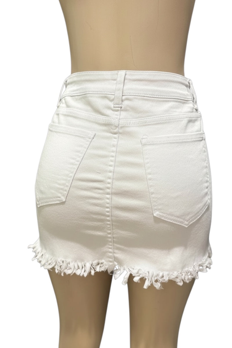White denim skirt with fringe hem on a mannequin against a white background