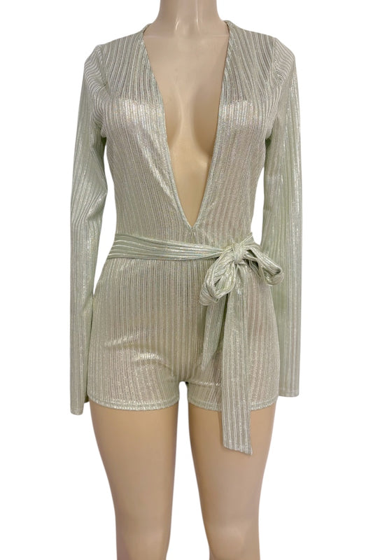 A shimmering metallic long-sleeve romper with a deep V-neckline, vertical textured stripes, and a matching waist tie, displayed on a mannequin against a white background.