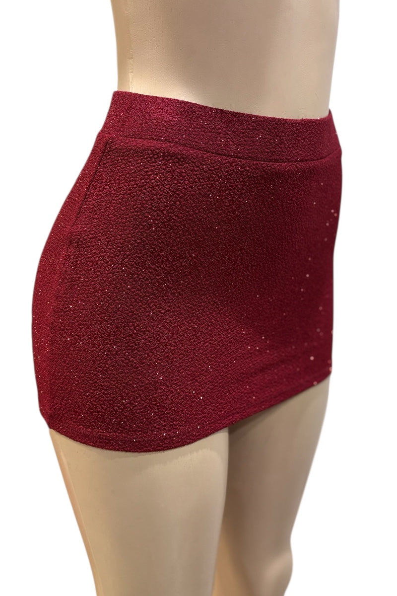 burgundy glittery skirt on a mannequin against a white background