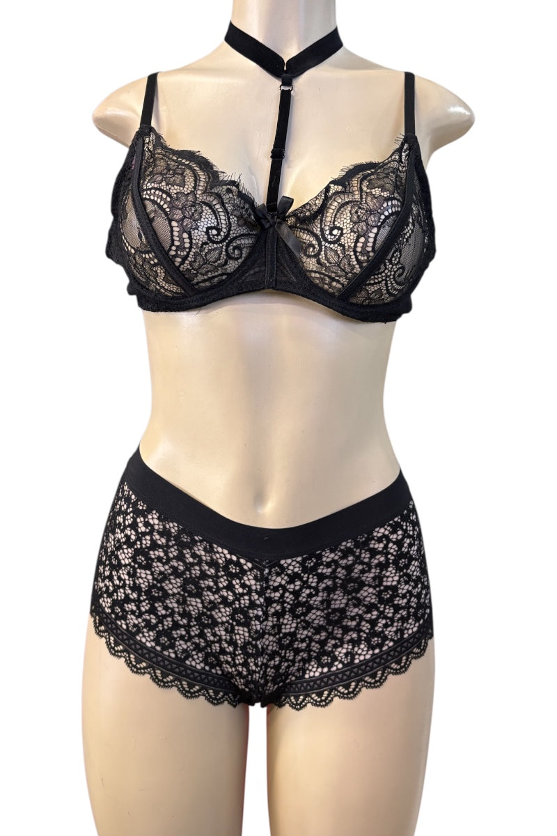 Black lace lingerie set consisting of a halter-neck bra and matching high-waisted briefs, displayed on a beige mannequin torso against a plain white background.