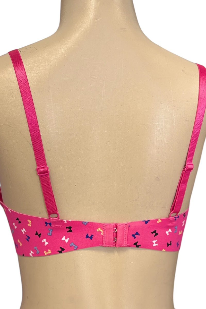Pink bra with bow pattern on a mannequin
