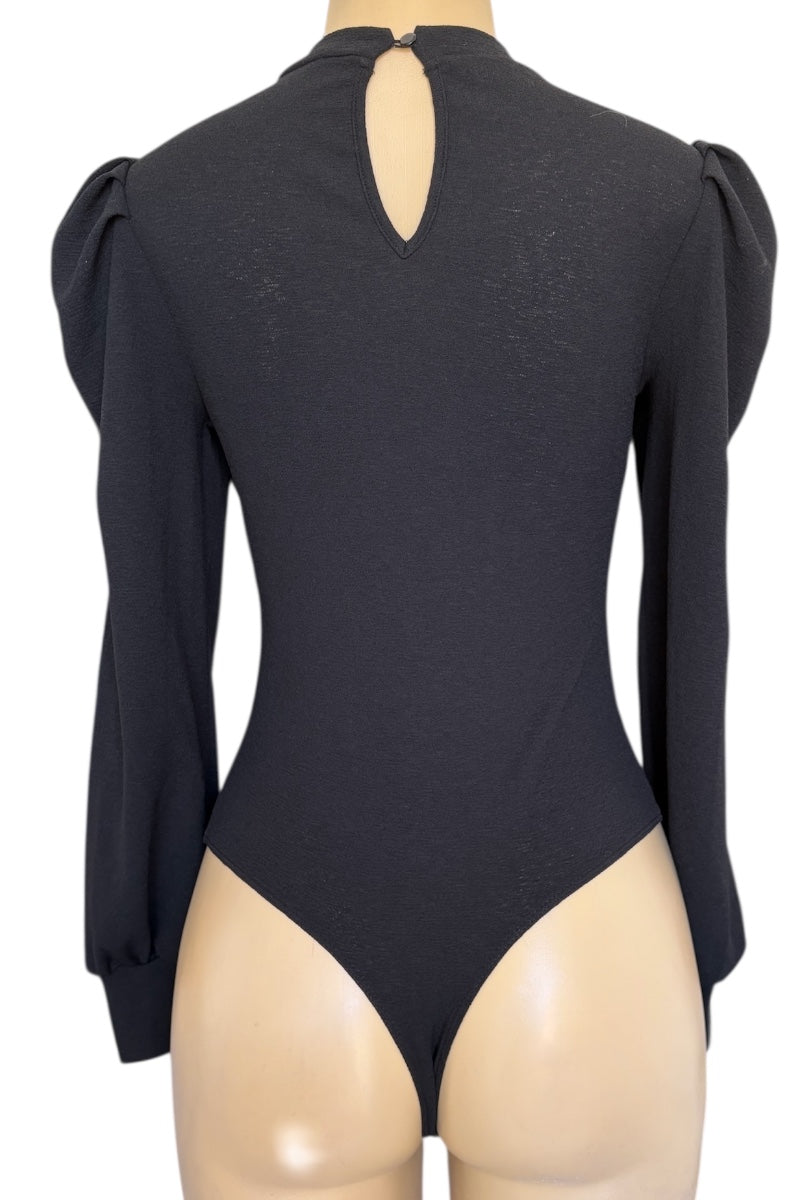 Black bodysuit with long sleeves on a mannequin against a white background