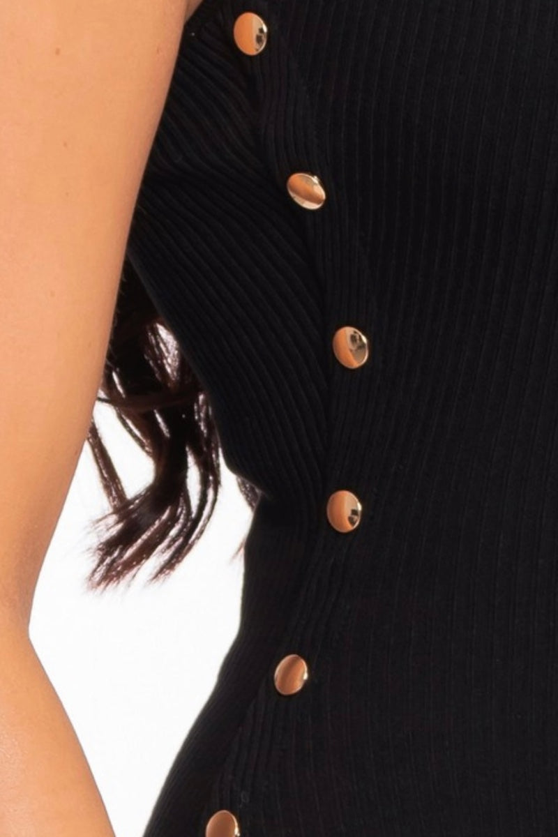 close up of Black ribbed jumpsuit with gold buttons on a white background
