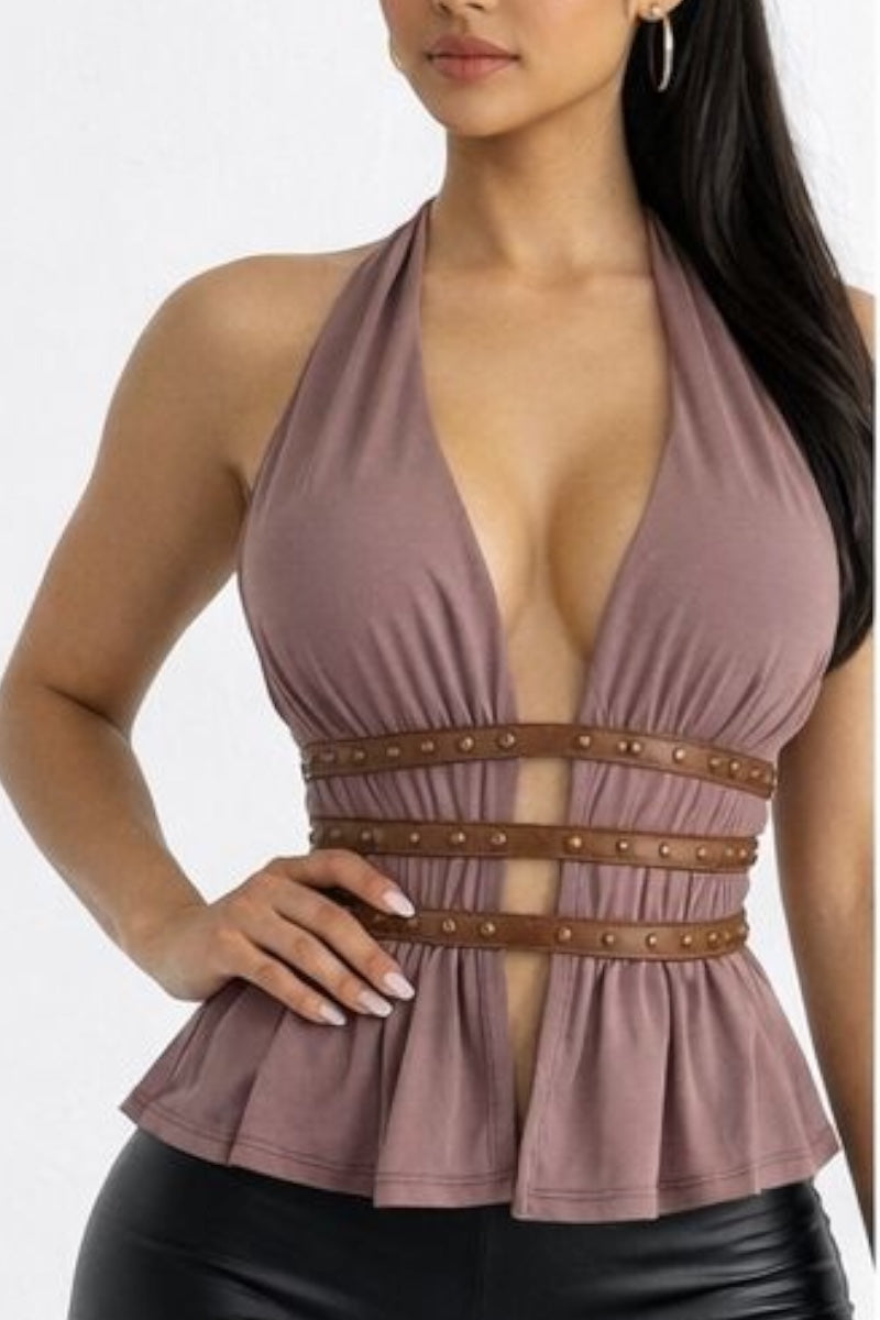 Woman wearing a brown halter top with a brown belt on a white background