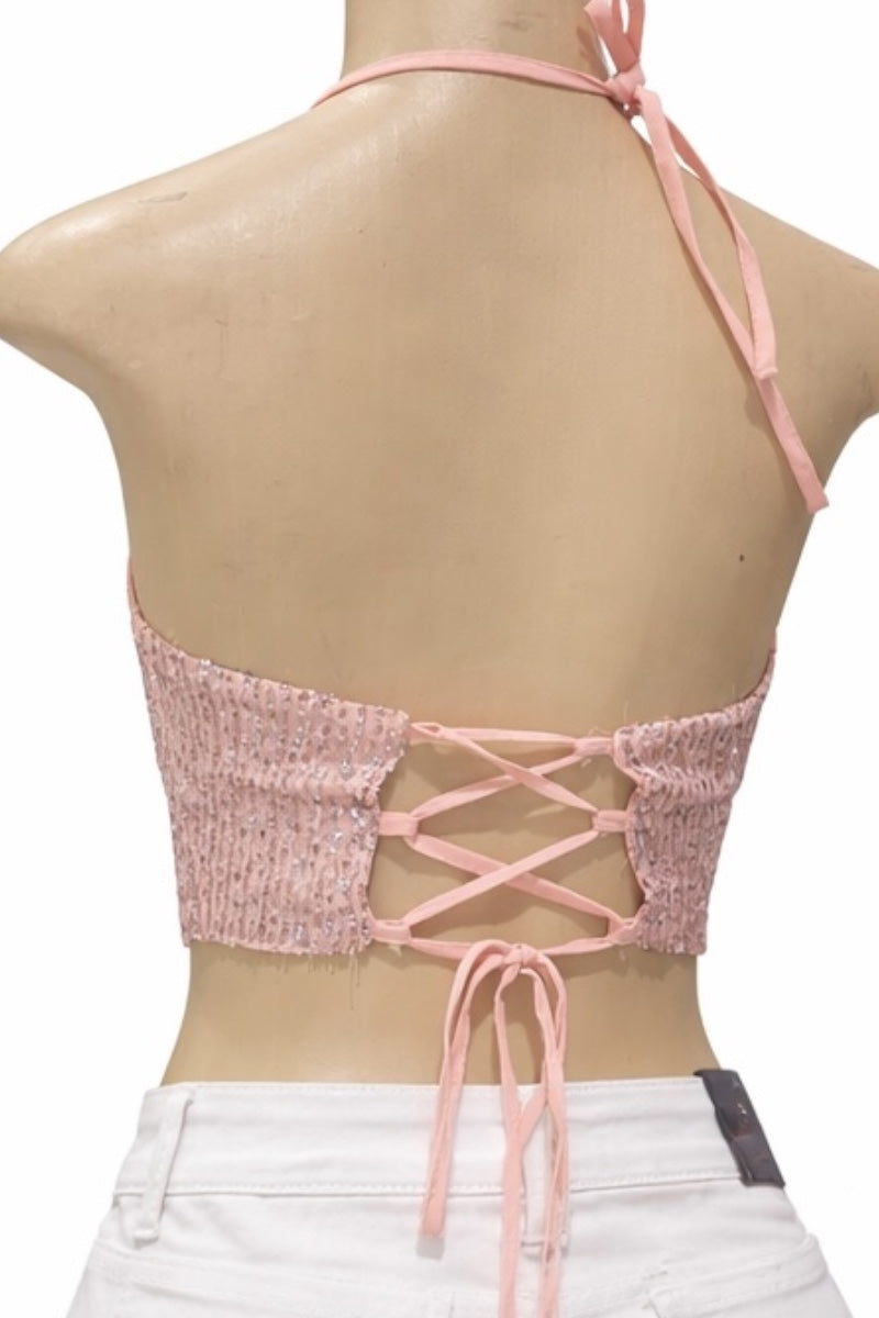 Pink lace-up top on a mannequin with a white background