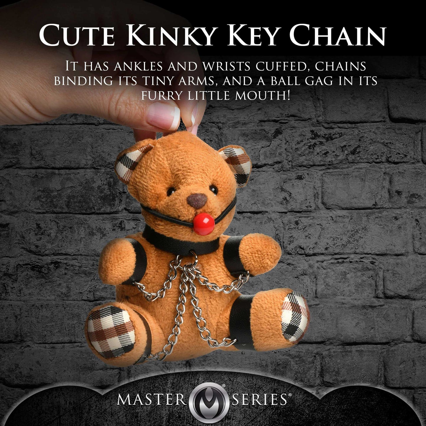 Cute Kinky Key Chain with teddy bear design against a brick wall background