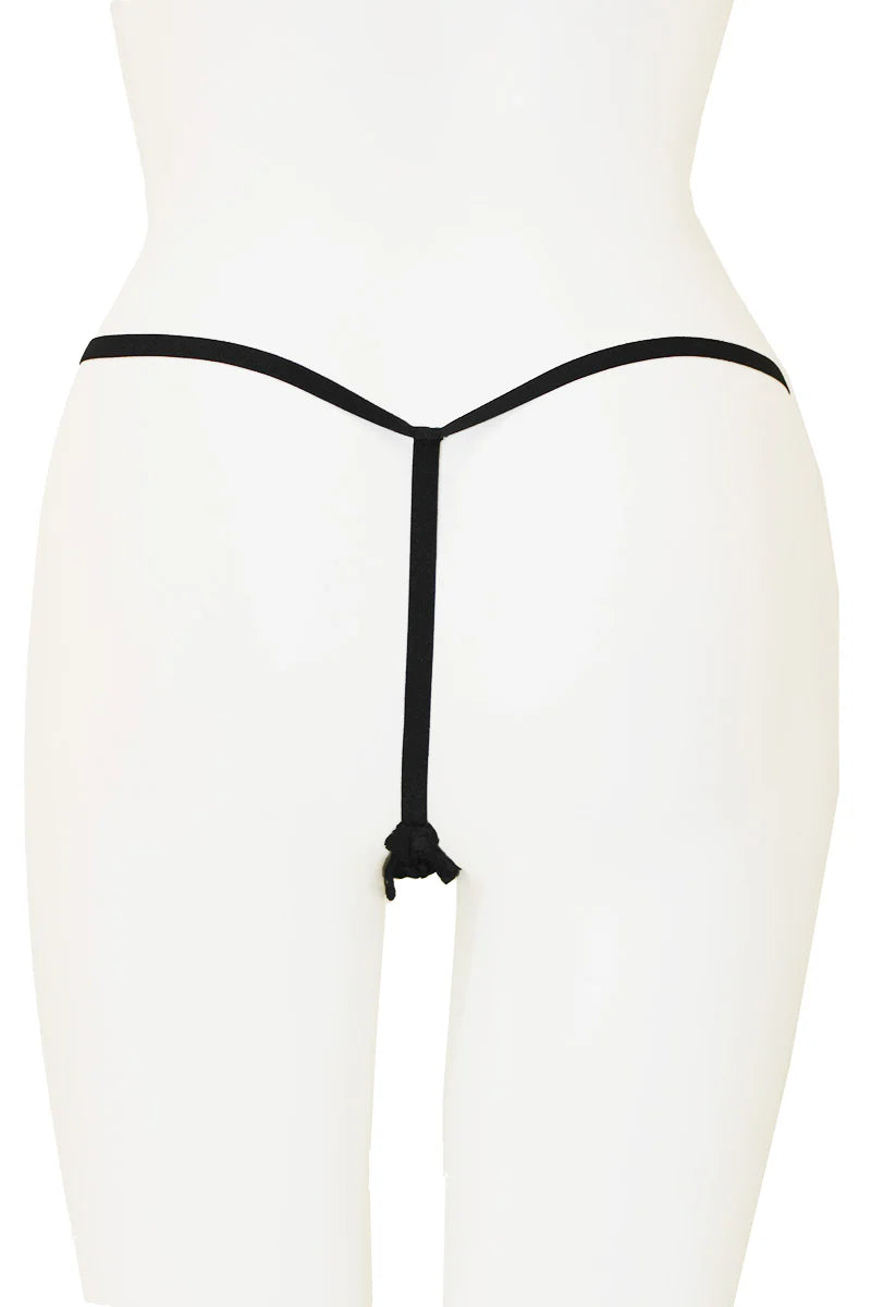 Black thong on a white mannequin against a white background